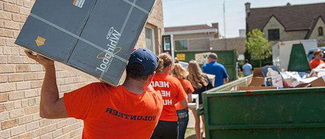 students moving furniture during move in day 